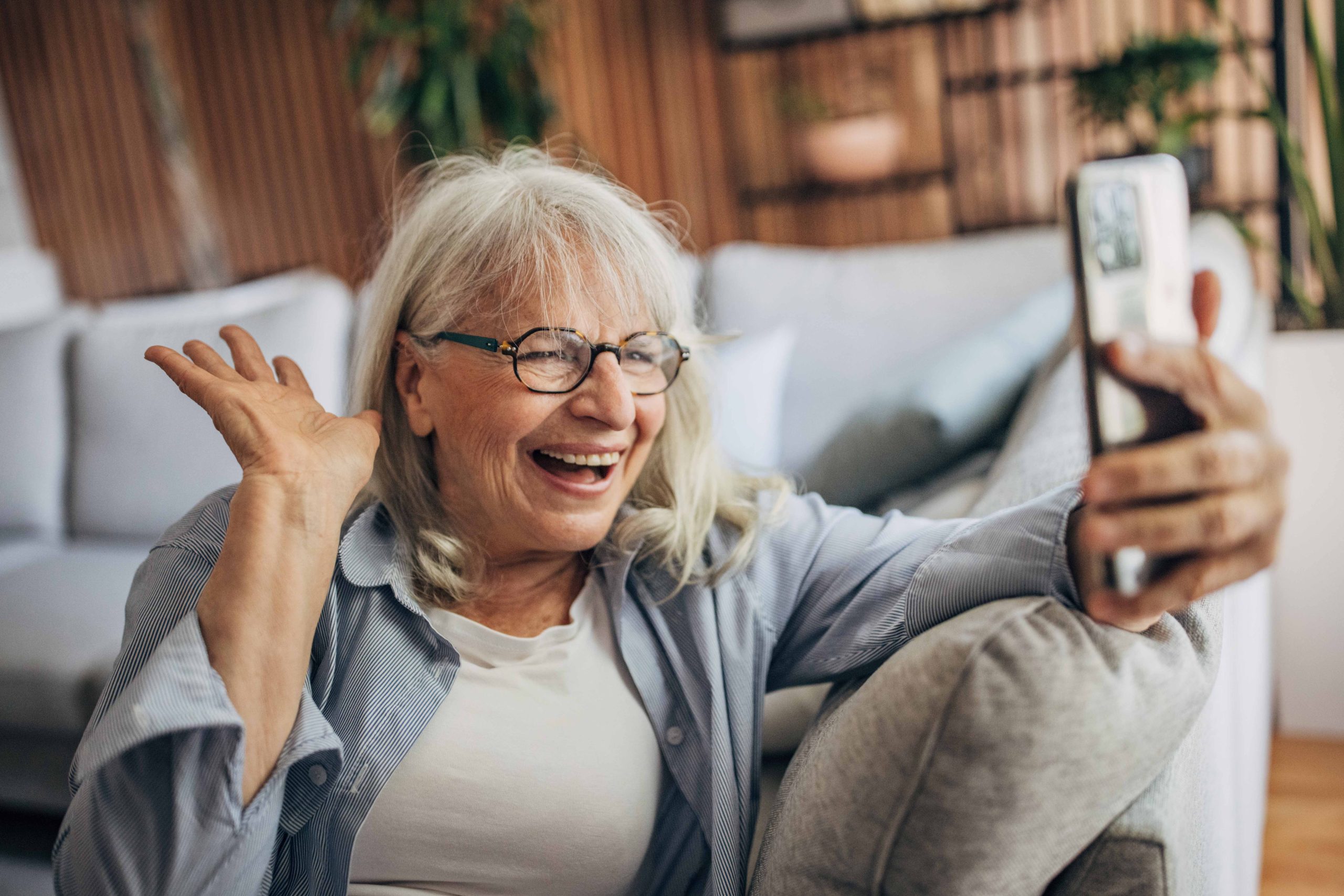 senior-woman-sitting-at-home-and-using-smartphone-2